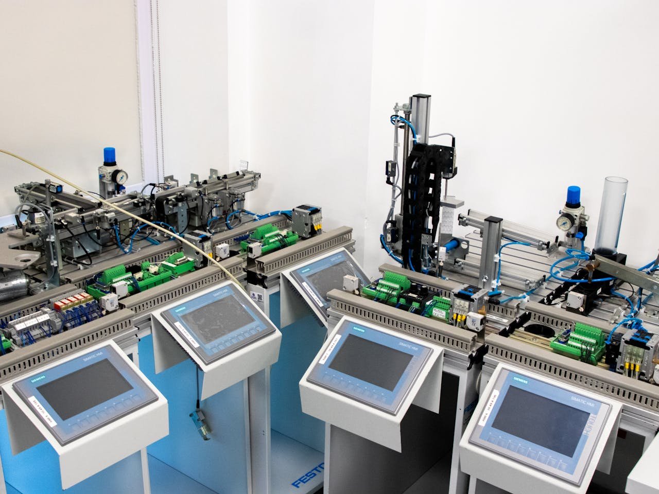 services-01 High-tech industrial automation system with control panels indoors.