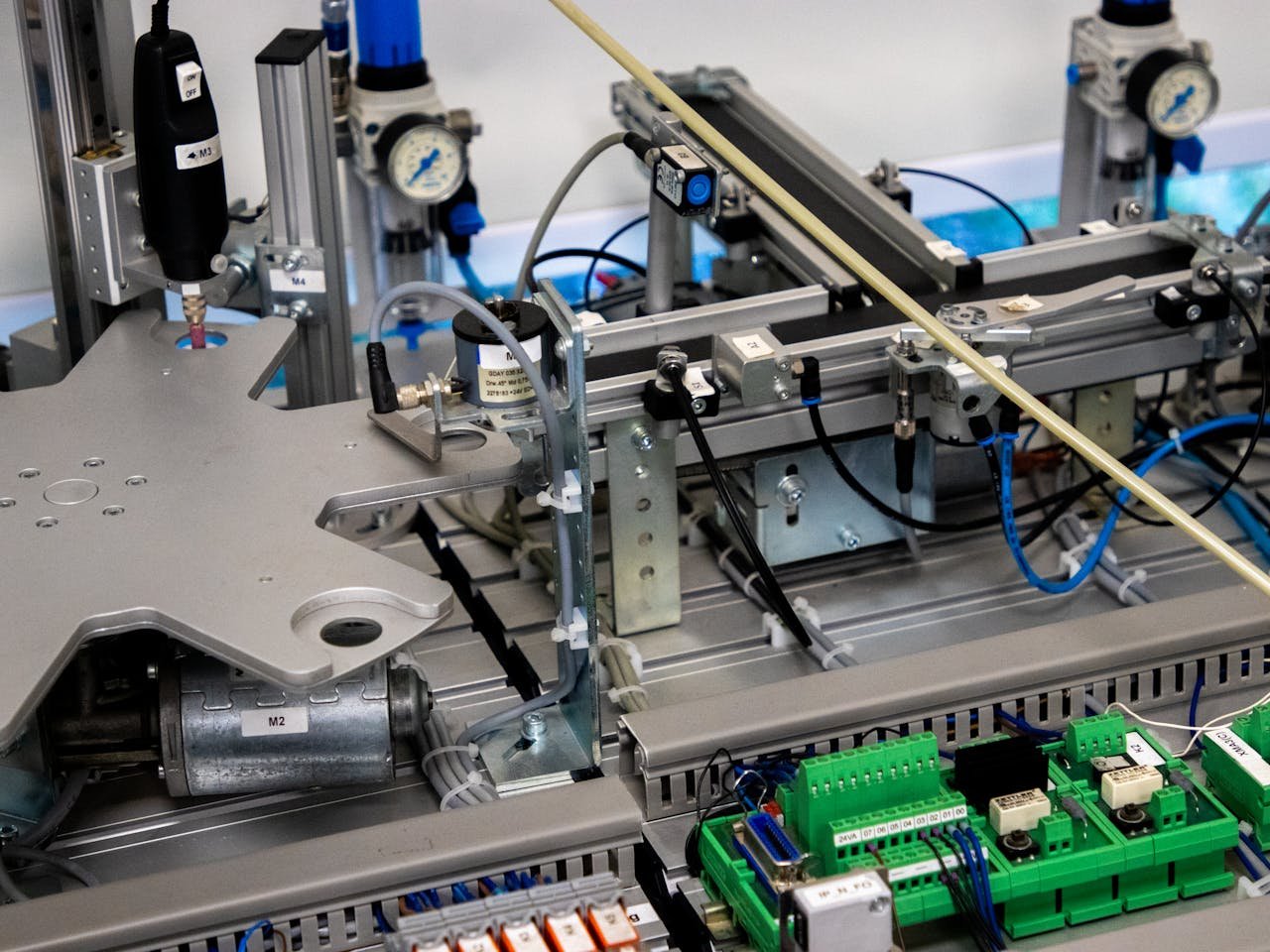 our-experience Close-up of advanced machinery showcasing robotic automation and precision engineering.